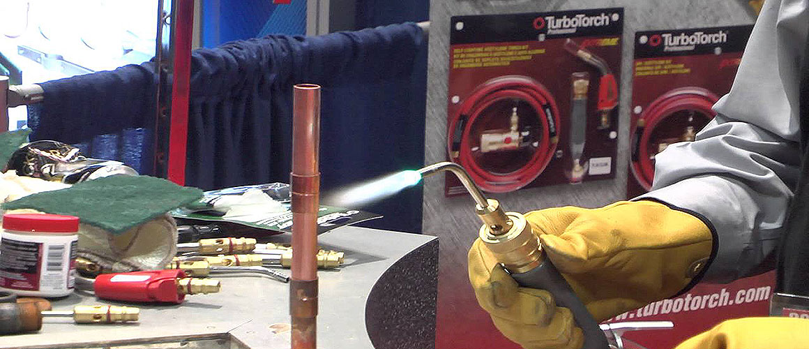 Welding cutting torch flame in workshop